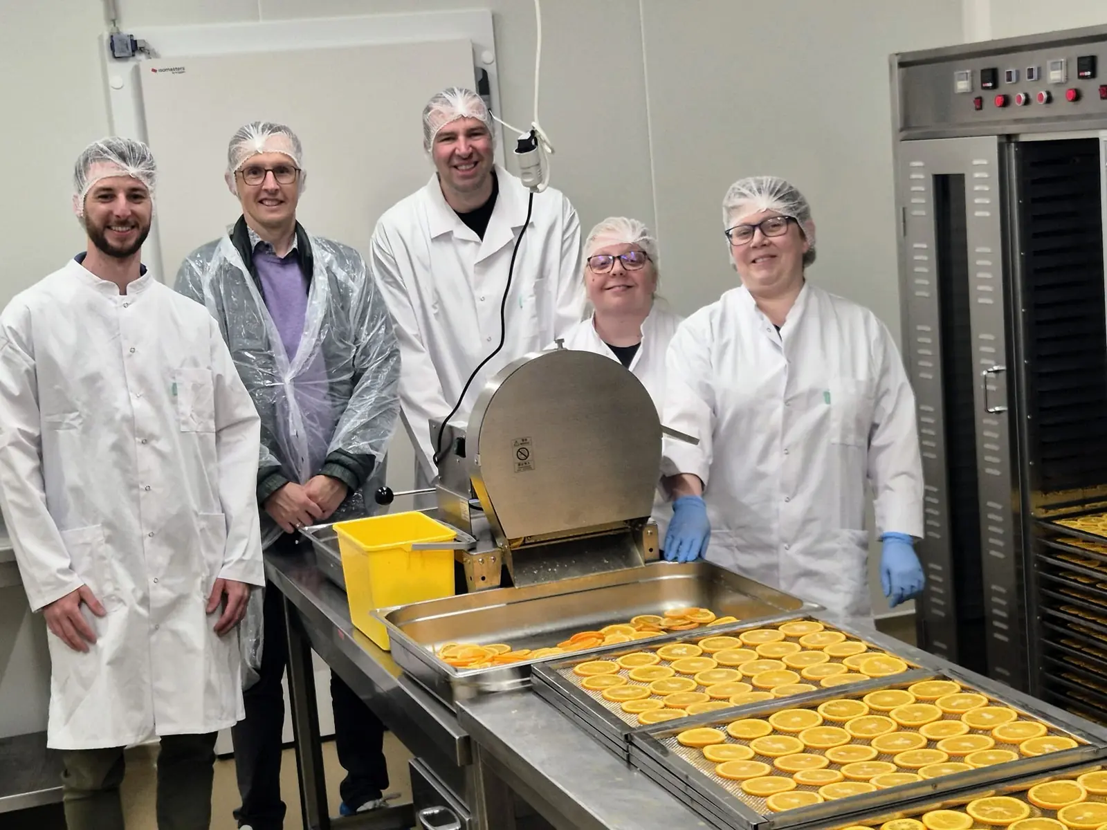 Maxim with the FruCare team making dried fruit slices